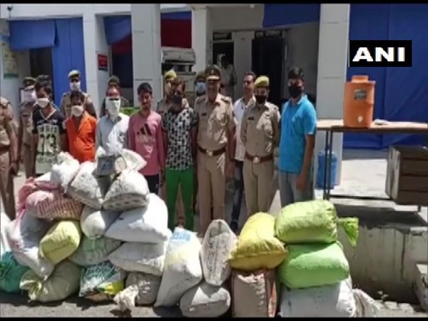 The police team with the nabbed accused and seized drugs on Thursday. Photo/ANI
