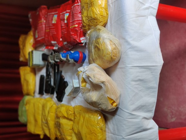 Narcotics and arms, ammunition recovered in the joint operation by the security forces in Jammu and Kashmir. Photo/ANI