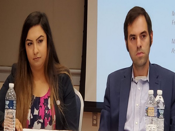 Duo Kalhoro, left, with UNPO representative 