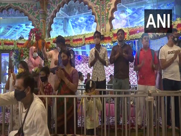 Visuals of the devotees offering prayers at the ISKCON temple, Punjabi Bagh. (Photo/ANI)