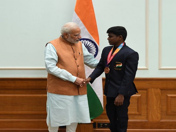 Prime Minister Narendra Modi with Mariyappan Thangavelu (Photo/ Narendra Modi Twitter)