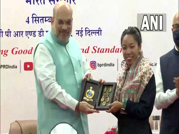 Union Home Minister Amit Shah felicitating Olympics medalist Mirabai Chanu in Delhi. (Photo/ANI)