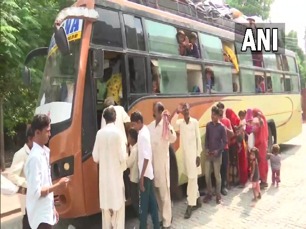 Pakistani nationals borading a bus to Attari-Wagah border. (Photo/ANI)