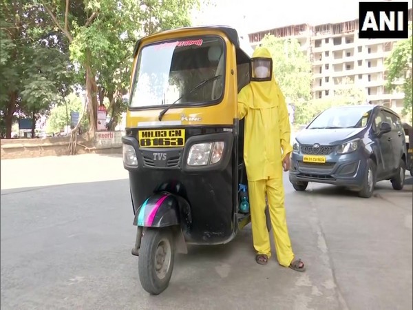 Dattatraya Sawant along with autorickshaw in Mumbai. (Photo/ANI)