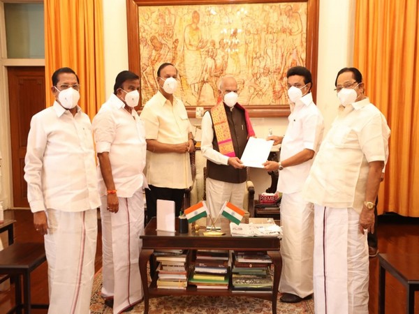 MK Stalin handling over a resolution to Governor Banwarilal Purohit.