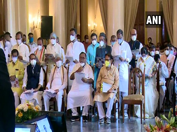 TMC leaders taking oath at Raj Bhavan in Kolkata. (Photo/ANI)