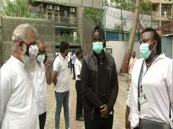 Kenya's Deputy High Commissioner Irene Achieng Oloo (right) with son
