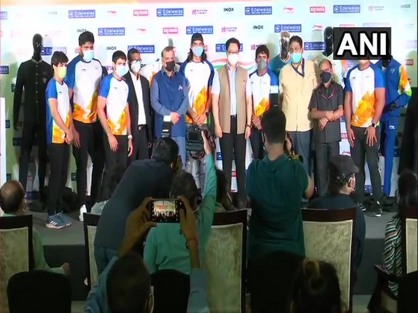IOA chief Batra, Sports Minister Rijiju and athletes at the unveiling of India's Olympic uniform