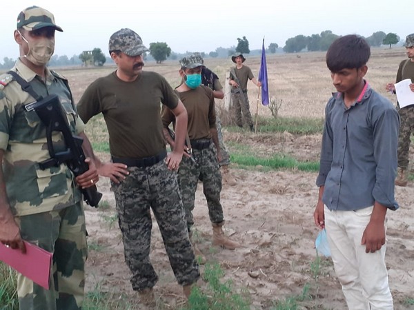 The Pakistani intruder with BSF jawans (Photo/ANI)