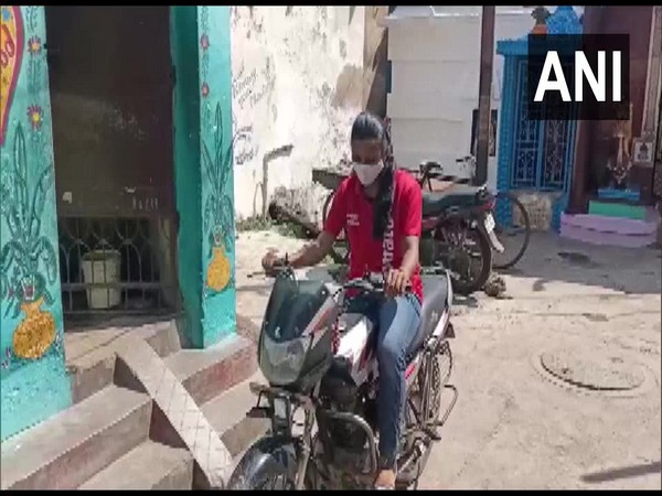 Bishnupriya Swain on her bike delivering food. (Photo/ANI) 