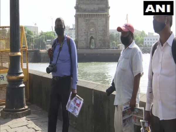 Photographers waiting for tourists in the vicinity of Gateway of India, Mumbai (Photo/ANI)