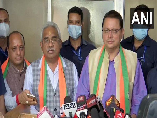 Madan Kaushik and Pushkar Singh Dhami (File Photo)