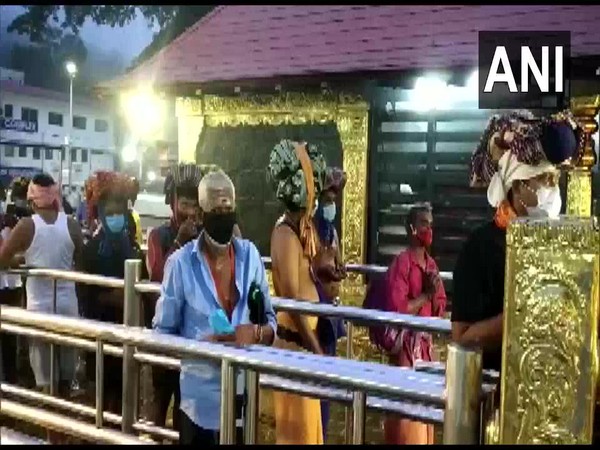 Devotees offer their prayers at the Sabarimala temple. (Photo/ANI)