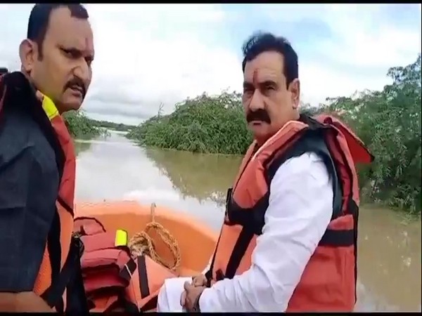 MP Home Minister Narottam Mishra after being rescued from the flood-affected village. (Photos/ANI)