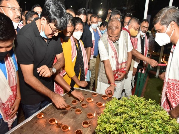 Assam CM Himanta Biswa Sarma lighting an earthern lamp for boxer Lovlina Borgohain (Photo/ANI)
