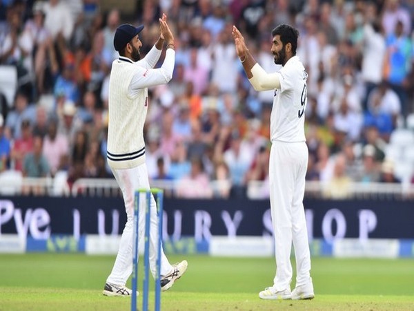 Bumrah celebrates with Cheteshwar Pujara (Photo/ BCCI Twitter)