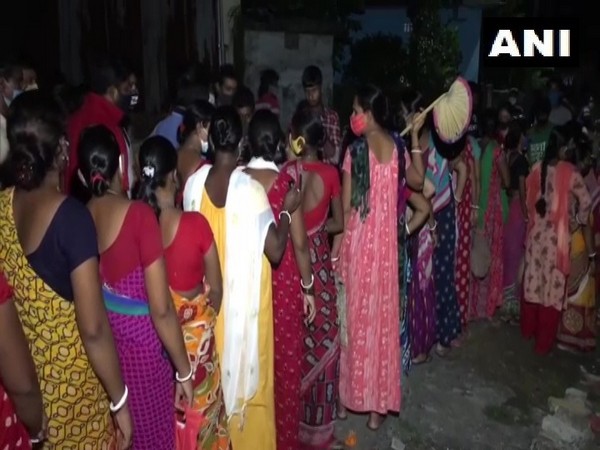 Women waiting outside Niranjan Nagar Covid vaccine centre (Photo/ANI)