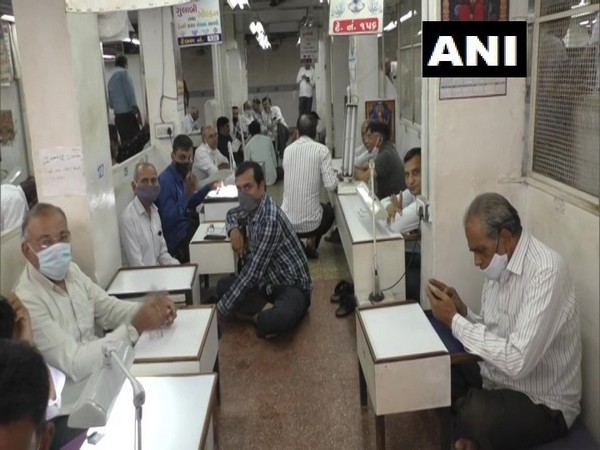 Workers at a diamond polishing workshop in Surat (ANI)