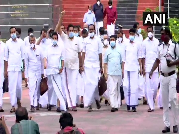 MLAs staging a walkout from the assembly. (Photos/ANI)