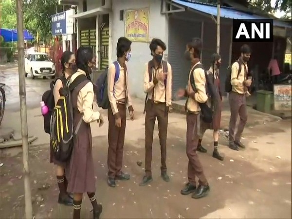 Students of Holy Cross School after their school re-opened in Raipur on Monday. [Photo/ANI]