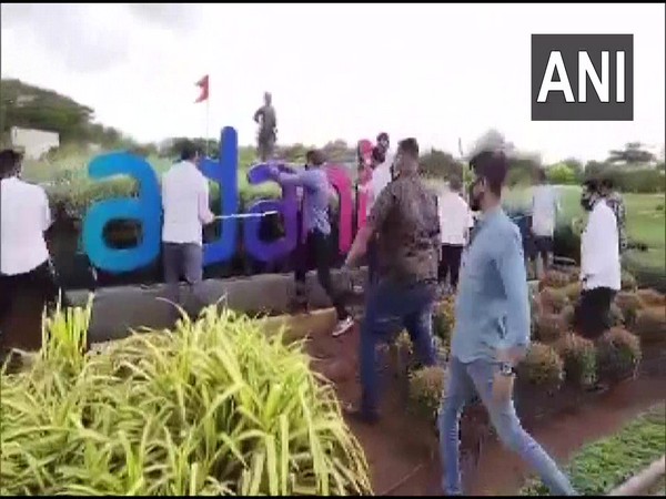 Shiv Sena workers vandalise Adani signboard at Mumbai Airport (Photo/ANI)