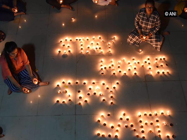 People are lighting diyas in Patna on Sunday. Photo/ANI