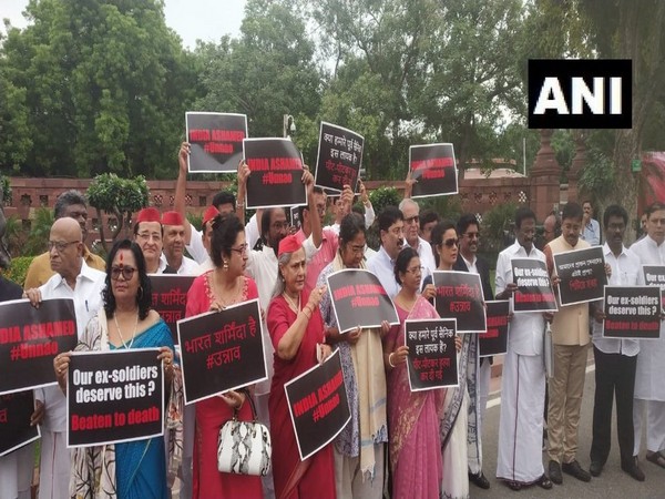 SP and TMC MPs stages protest outside the Parliament buidling in New Delhi. [Photo/ANI]