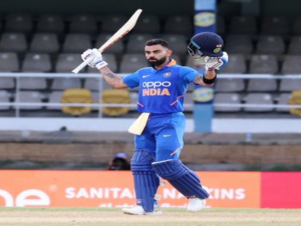 Indian skipper Virat Kohli raises his bat after scoring a century against West Indies in third ODI. (Photo/BCCI Twitter)