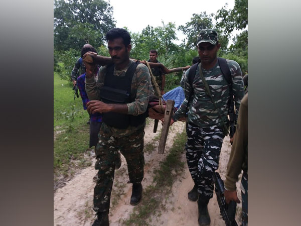 CRPF personnel carried a man bitten by snake on their shoulders for around 2.5 kms. Photo/ANI