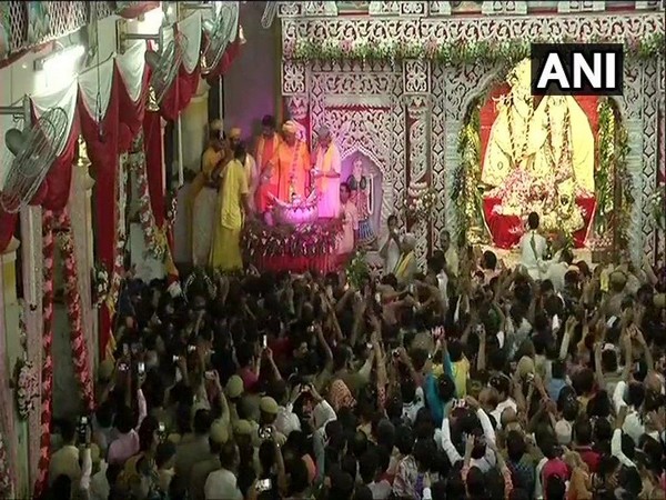 Devotees celebrating Janmashtami at Shri Krishna Janmabhoomi Temple in Mathura, UP.