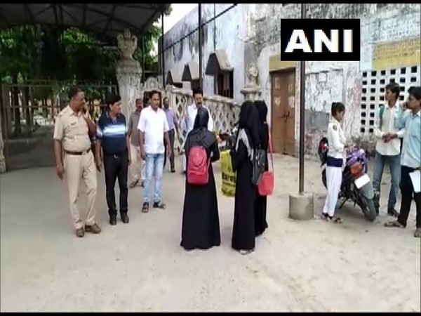 Firozabad:Some students were denied entry to SRK College,allegedly because they were wearing burqa. Photo/ANI