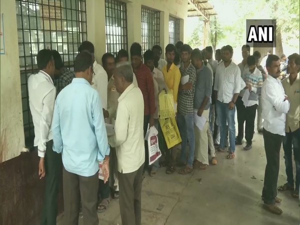 Locals queue up at the RTO office in Kalaburagi on Friday (Photo/ANI)