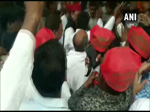 Chaos in PWD guest house as workers jostled to meet SP chief Akhilesh Yadav on Sunday. Photo/ANI