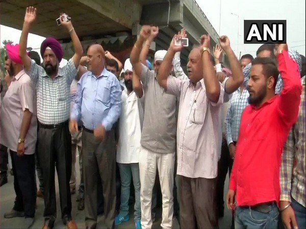 Members of All Jammu and Kashmir Transport Welfare Association hold strike in Samba on Thursday. Photo/ANI