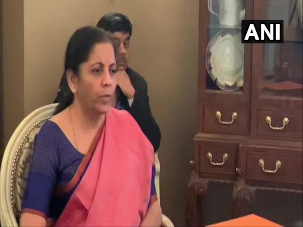 Union Finance Minister Nirmala Sitharaman talking to reporters in Washington