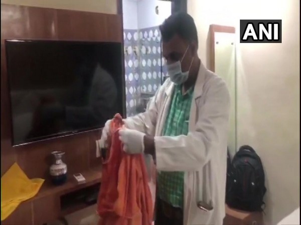 Saffron-coloured cloth with blood stains on it was found from the hotel room. Photo/ANI 
