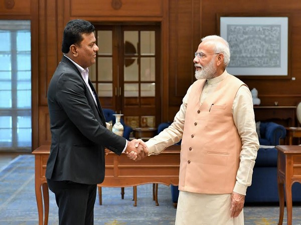 Prime Minister Narendra Modi with Captain Amol Yadav in New Delhi on Sunday. 