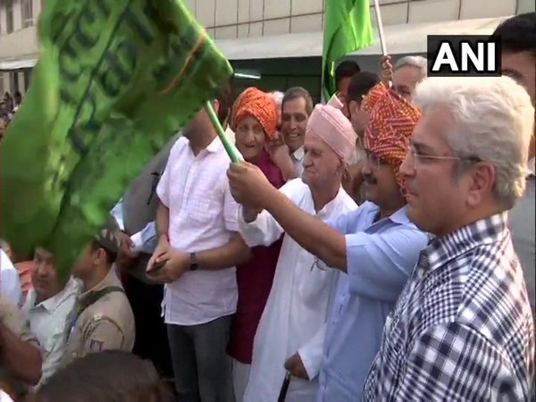 Delhi Chief Minister Arvind Kejriwal flagging off 104 new CNG buses. (Photo/ANI)