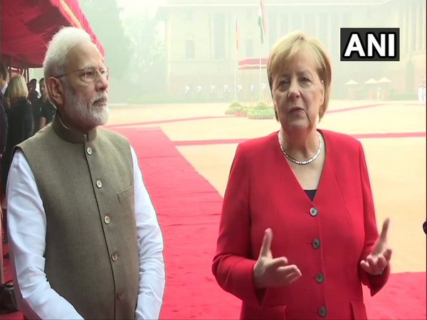 Prime Minister Narendra Modi and German Chancellor Angela Merkel at Rashtrapati Bhawan on Friday