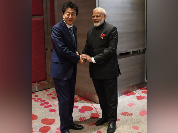 PM Modi along with his Japanese counterpart Shinzo Abe in Bangkok on November 4. Photo/Twitter