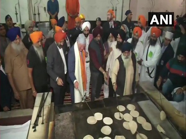 Prince Charles was seen flipping roties at Gurudwara Bangla Sahib during his three day visit to India on Wednesday in New Delhi. Photo/ANI
