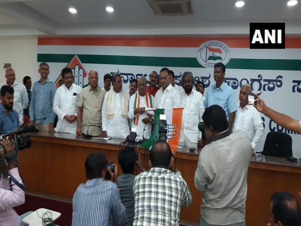 Former BJP MLA Raju Kage (holding Congress party flag) joining Congress in Bengaluru on Thursday.