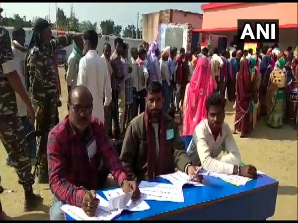People stood in queues outside polling booths to exercise franchise in Naxal affected area of Kanhachatti in Chatra district (Photo/ANI)