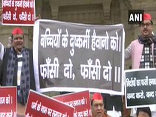 Visuals of SP leaders holding a protest in front of Lucknow Assembly on Tuesday. Photo/ANI