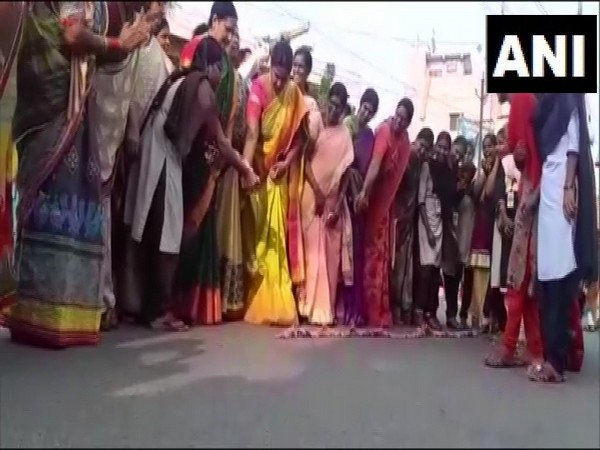 Women bursting fire-crackers to celebrate encounter killing of four rape accused in Krishna, Andhra Pradesh, on Friday.