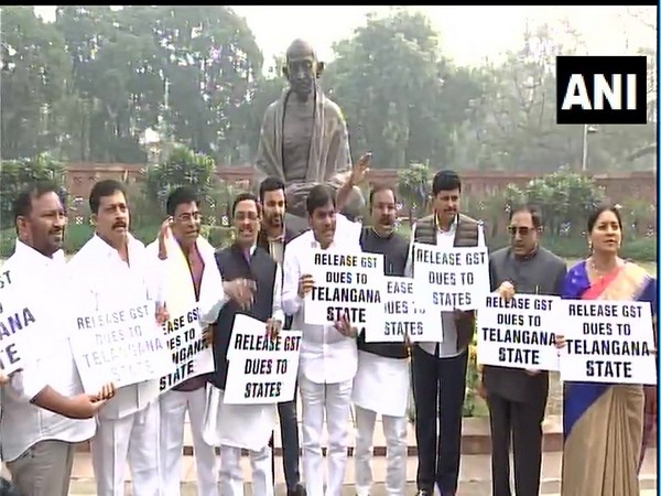 TRS MPs protest in Parliament premises in New Delhi on Wednesday.