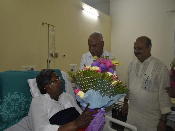 Siddaramaiah received a flower bouquet from Chief Minister BS Yediyurappa and his two ministers. (Photo/ANI)