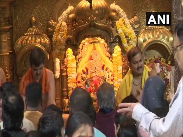 Devotees at Shree Siddhivinayak Ganapati Temple in Mumbai on Wednesday.