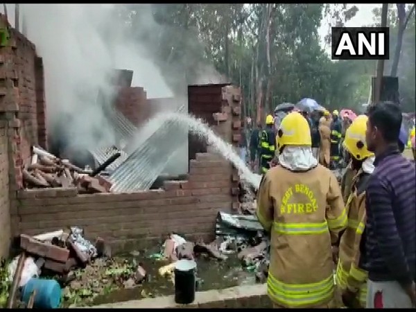 Firemen dousing the fire at a cracker factory in West Bengal's North 24 Parganas district on Friday.