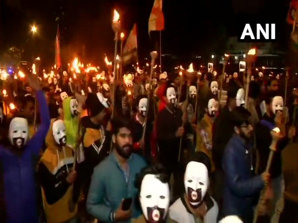 Indian Youth Congress members hod march against yesterday's violence at Jawaharlal Nehru University.
